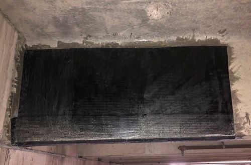 Carbon fiber wrap on the underside of a concrete beam