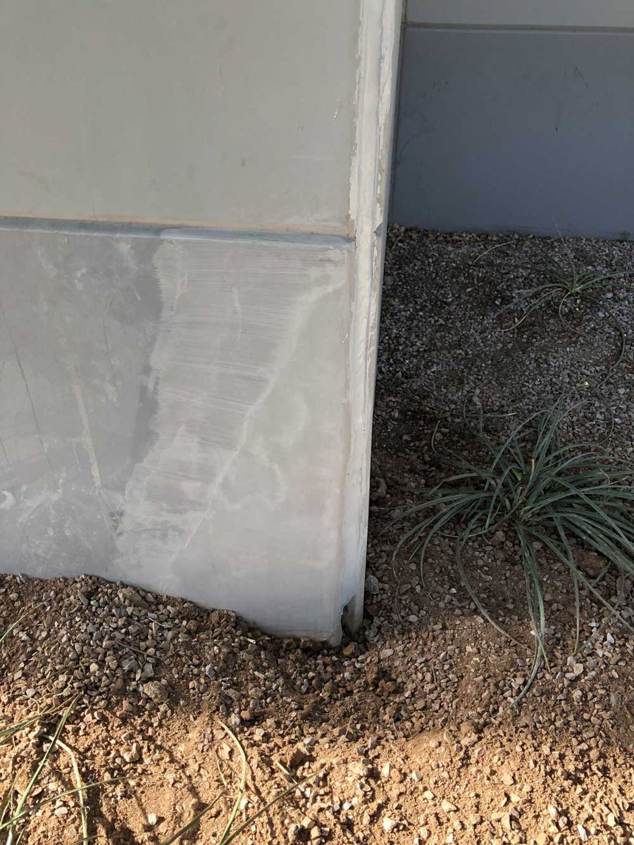 Base of a tilt-panel building wall after repair